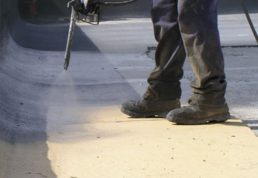 Coating systems over Denton spray foam roof systems